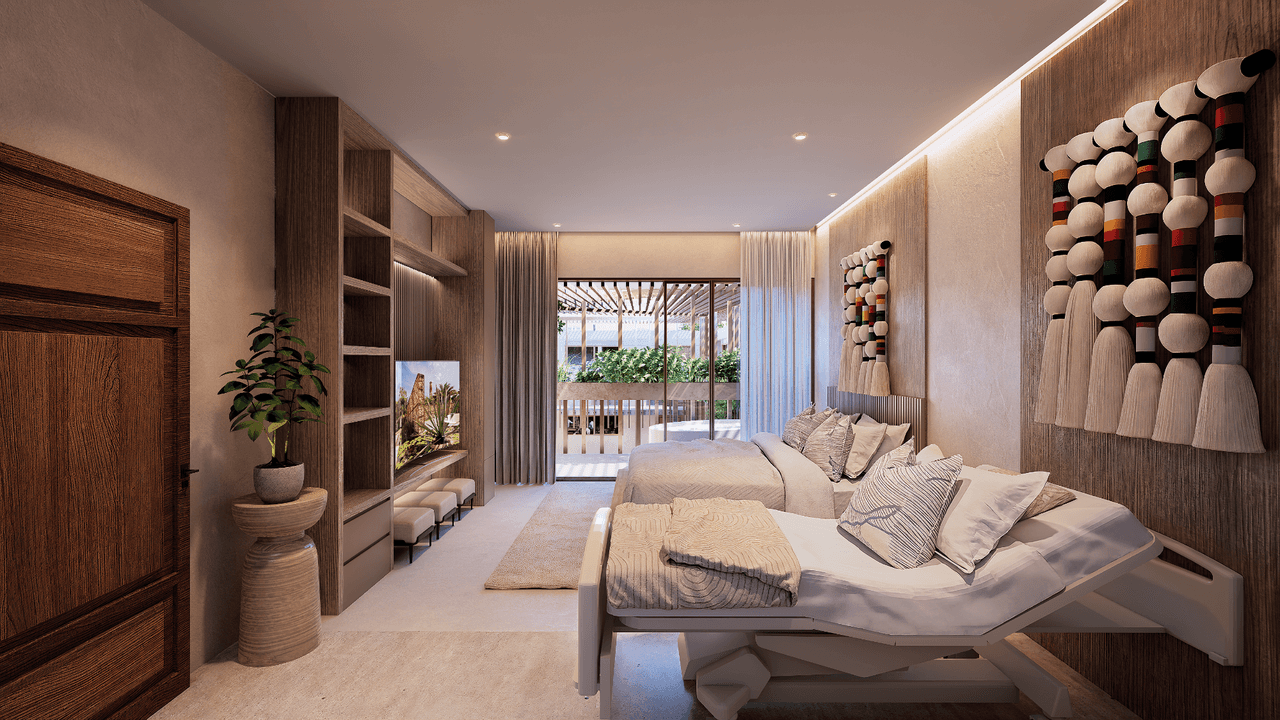 Suite de recuperación ReVibe Stays: ambiente cálido con camas hospitalarias, madera y vista al jardín tropical